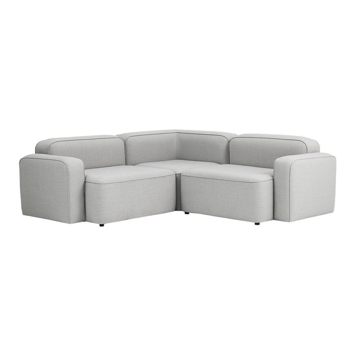 Modern gray sectional sofa with clean lines and no visible patterns, perfect for contemporary living spaces.
