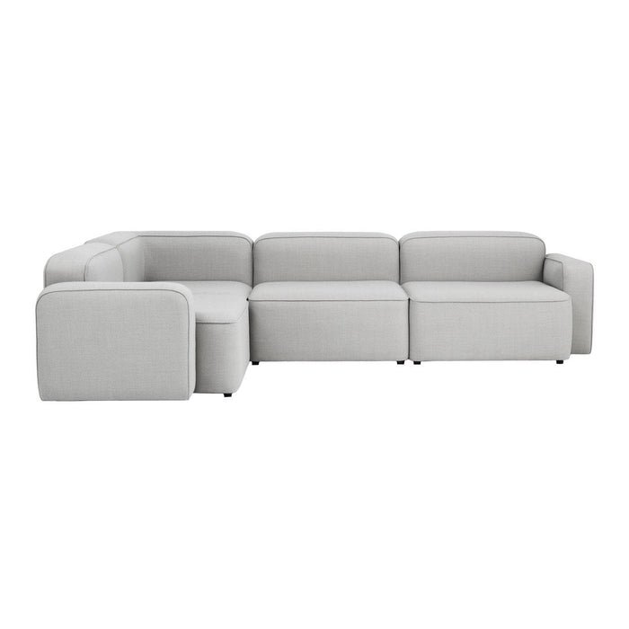 L-shaped sectional sofa in soft, light gray upholstery with a minimalist design and subtle texture.
