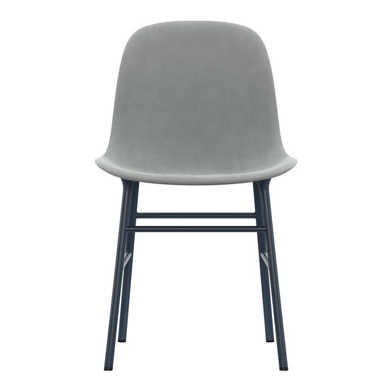 Gray velvet chair with a minimalist design and black metal legs, perfect for modern decor.