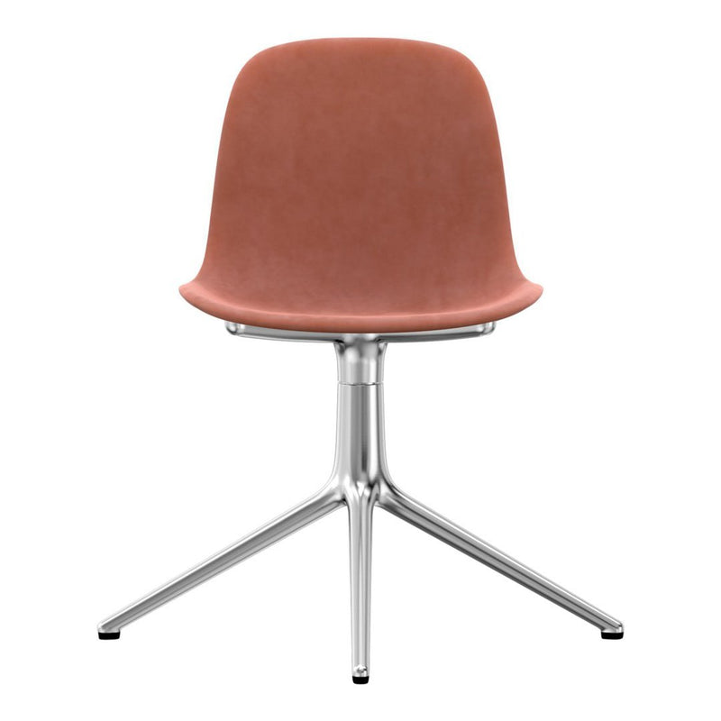 Light pink velvet chair with a sleek silver base, featuring a minimalist design and smooth curves.