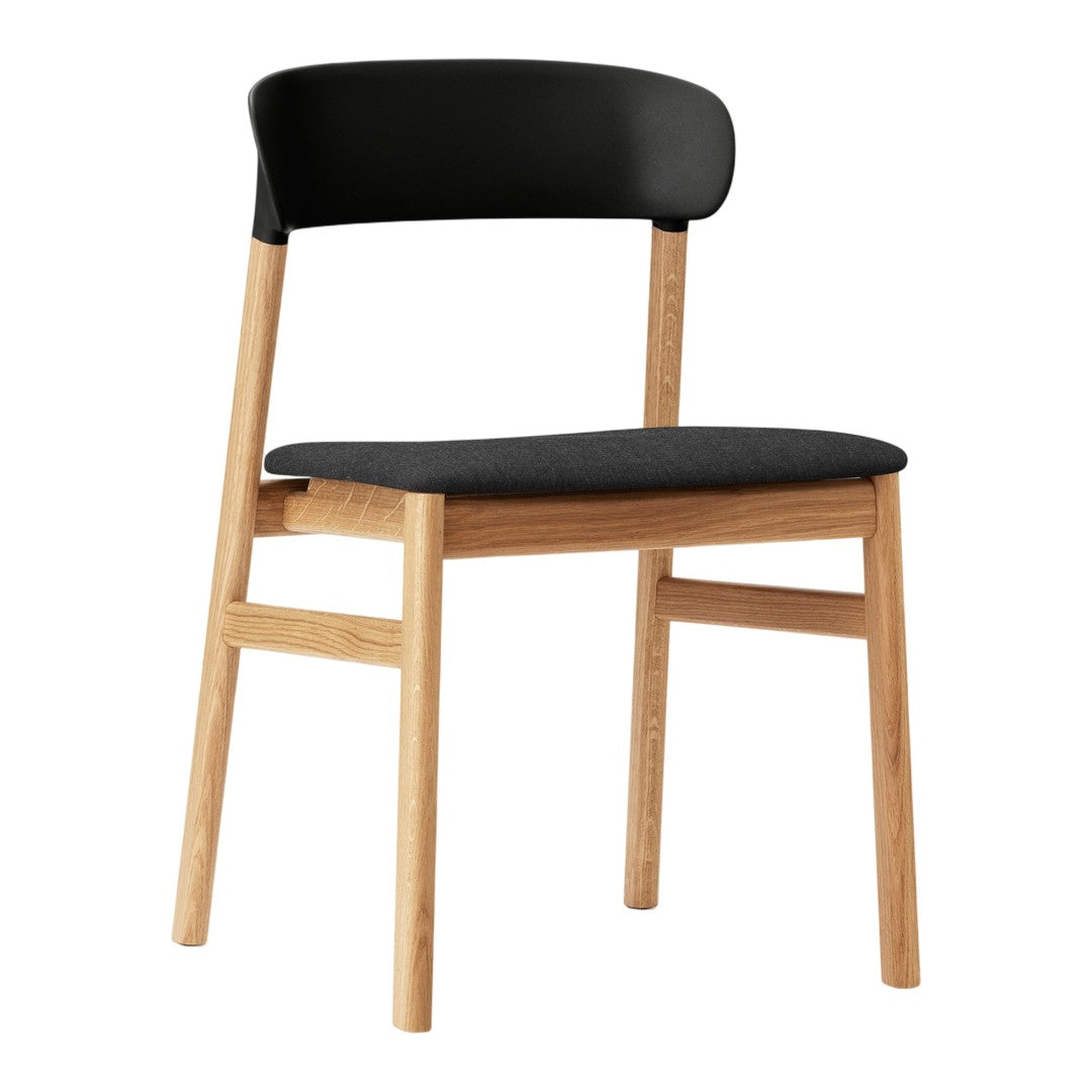 Black upholstered seat and backrest with natural wood legs, featuring a minimalist design.