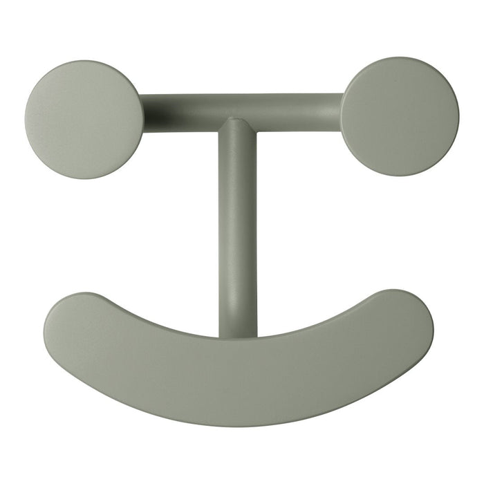 Green decorative wall hook with a playful smiley face design and smooth, rounded shapes. Perfect for any modern space.