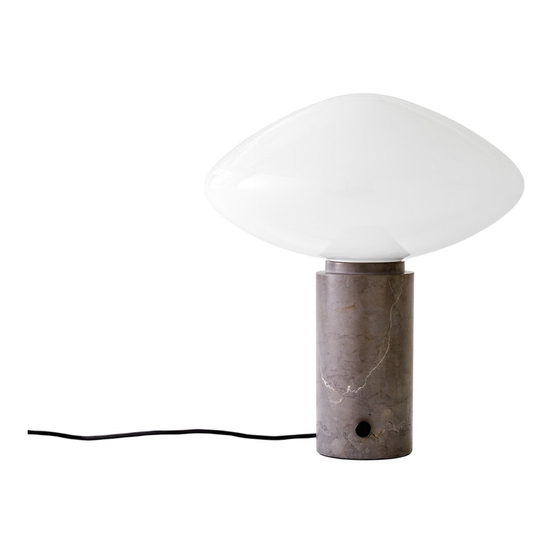 Contemporary table lamp featuring a white opaque glass shade and a grey marble base with subtle vein patterns.