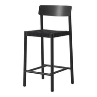 Black wooden bar stool with a simple, modern design and slatted seat pattern. Ideal for contemporary spaces.