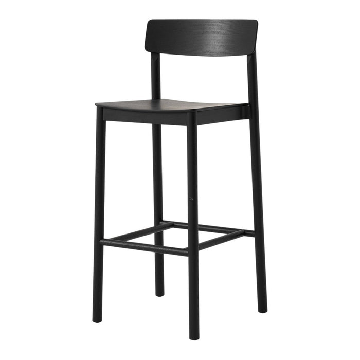 Black bar stool with a simple, sleek design and minimalistic patterns. Ideal for modern interiors.