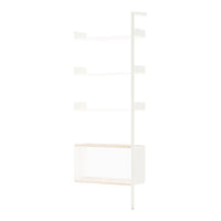 Modern white shelving unit with minimalistic design and light wood accents, showcasing a clean and airy aesthetic.