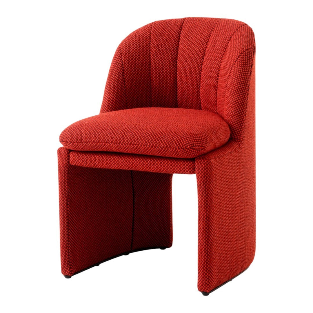 Stylish red chair with a textured pattern and curved design, perfect for modern interiors.