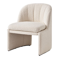 Textured cream accent chair with a curved back and thick cushioned seat, featuring subtle, soft patterns.
