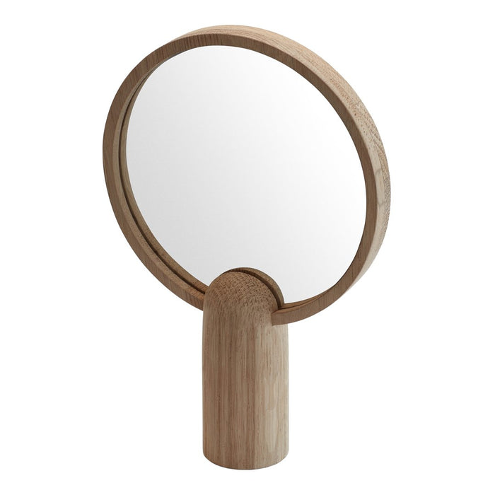 Wooden hand mirror with a round frame, showcasing a natural light beige finish and smooth, minimalist design.