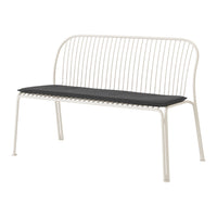 Minimalist white metal bench with a sleek black cushion, featuring a linear pattern in the backrest design.