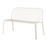 White metal bench with sleek, minimalist design featuring vertical line patterns for a modern aesthetic.