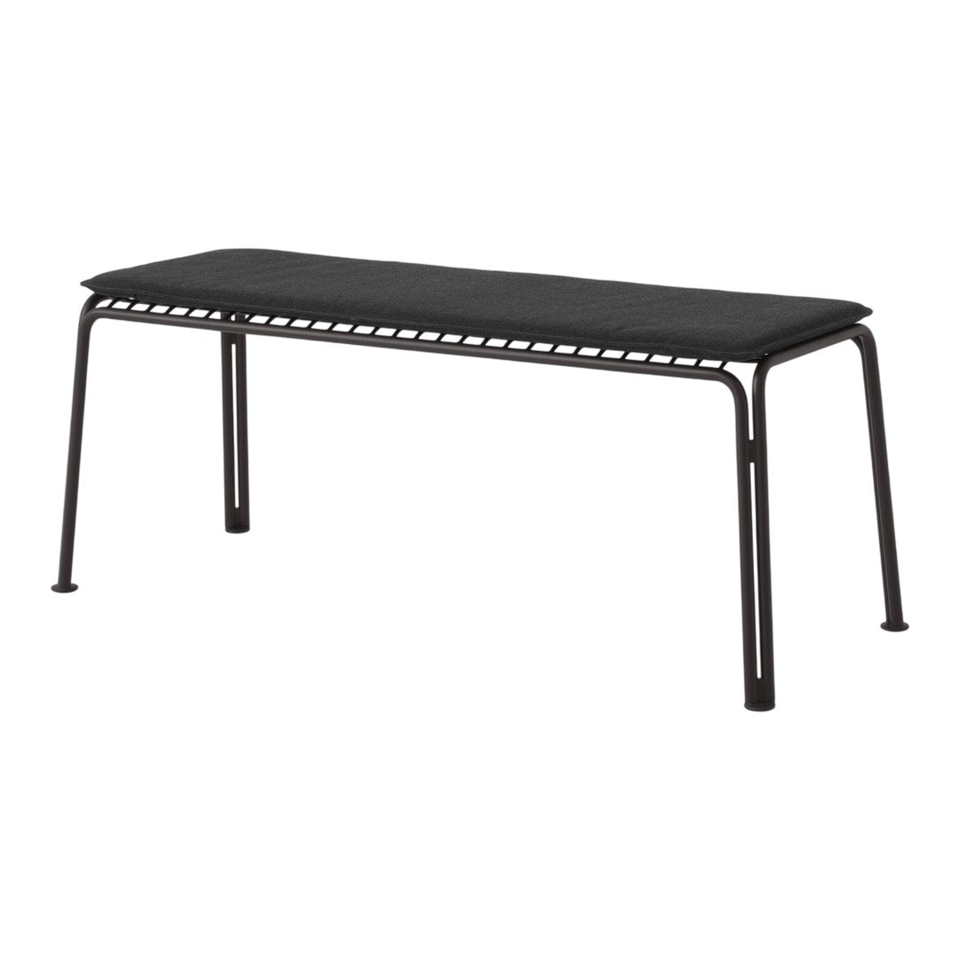 Sleek black bench with a minimalist design and perforated detailing for a modern touch. Perfect for any décor.