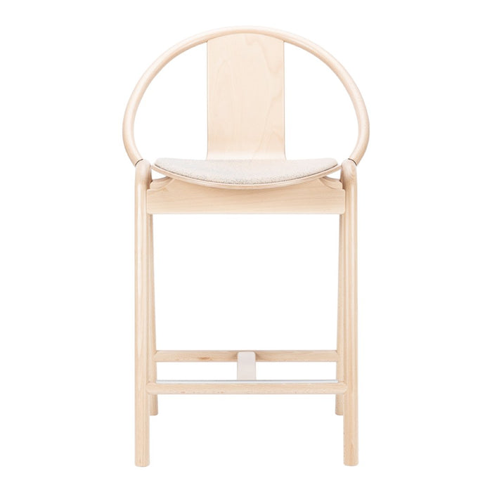 Light natural wood chair with a minimalist design and smooth, curved patterns, ideal for modern interiors.