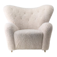 Textured cream armchair with a soft, fluffy appearance and tufted detailing. Ideal for modern decor styles.