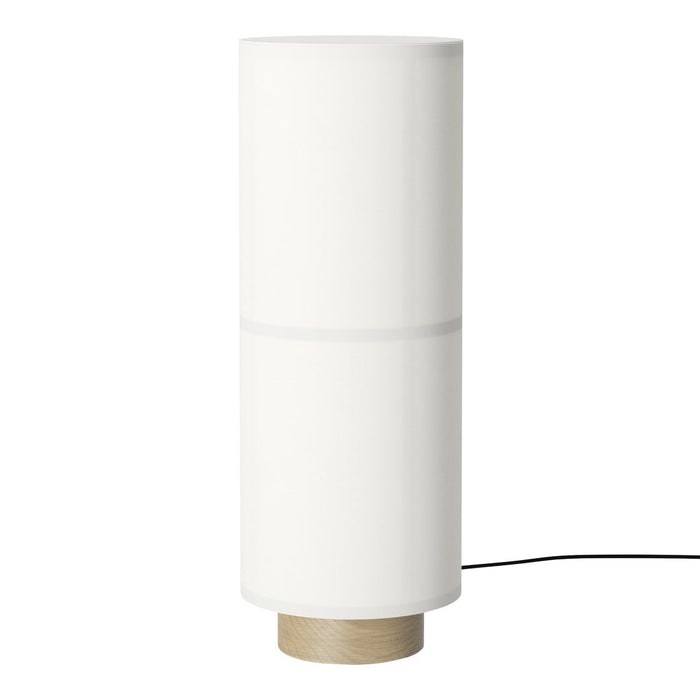 White cylindrical lamp with a textured wooden base. Modern design ideal for any decor style.