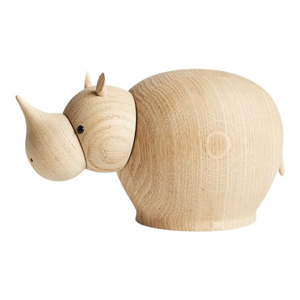 Wooden rhinoceros sculpture in natural light wood with smooth, rounded shapes and minimalistic design.