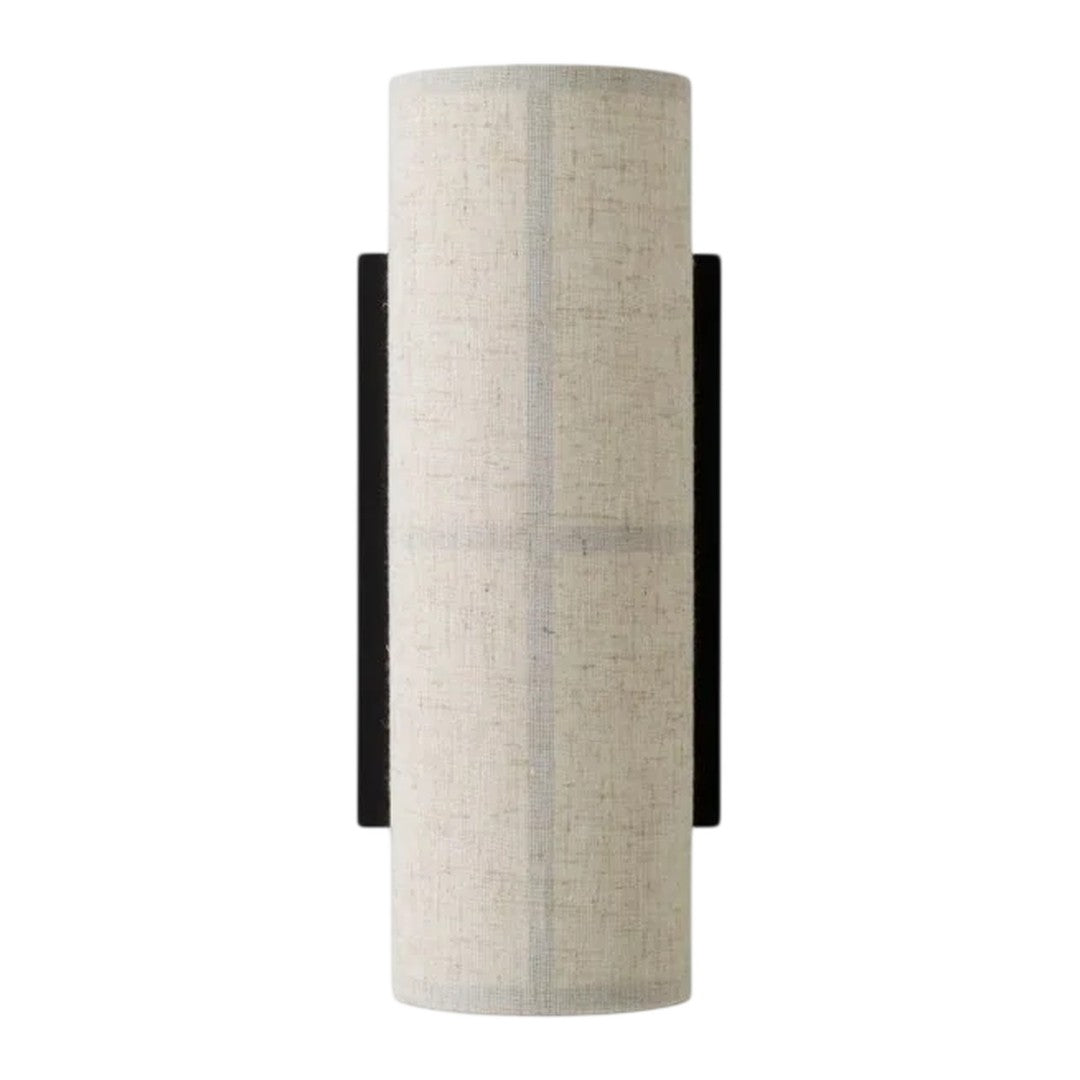 Light gray cylindrical lamp shade with a textured pattern, accented by a sleek black wall mount.