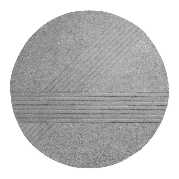 Gray round rug featuring textured striped patterns in various shades of gray. Modern minimalistic design.