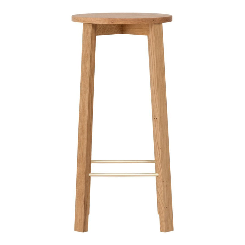 Natural wood bar stool in light oak finish with a smooth, round seat and simple, minimalistic design.