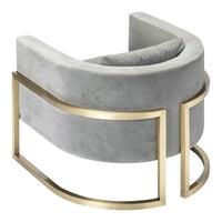 Curved gray velvet chair with gold metal accents, featuring a smooth and modern design. Ideal for stylish decor.