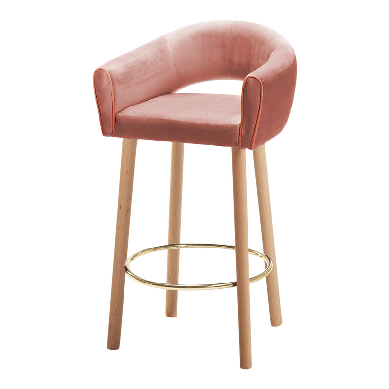 Pink velvet bar stool with golden accents and natural wood legs, featuring a modern, curved design.