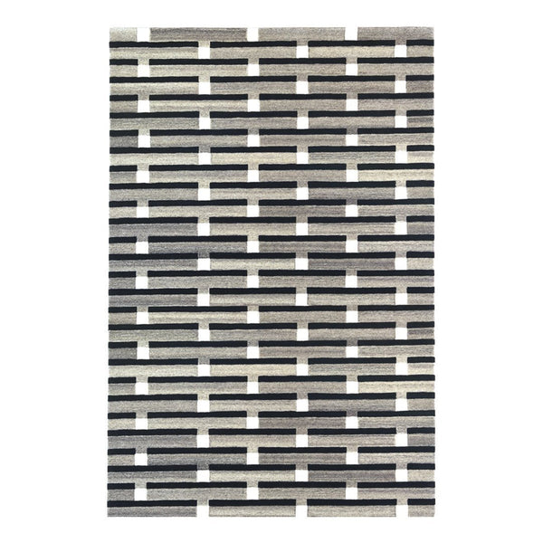 Black and white patterned rug featuring a geometric, grid-like design with alternating stripes.