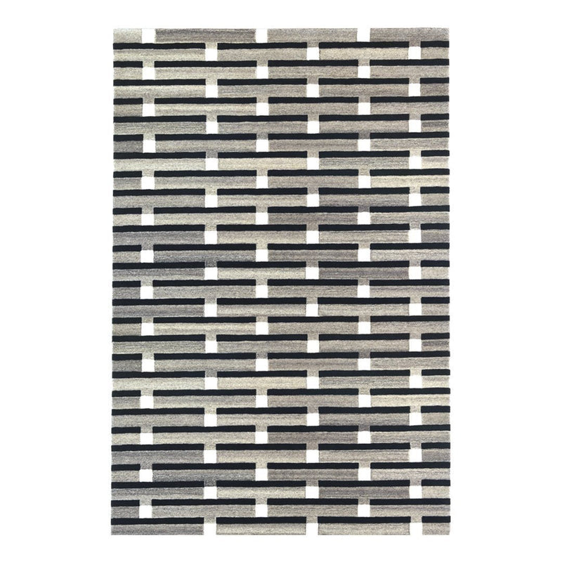 Black and white patterned rug featuring a geometric, grid-like design with alternating stripes.