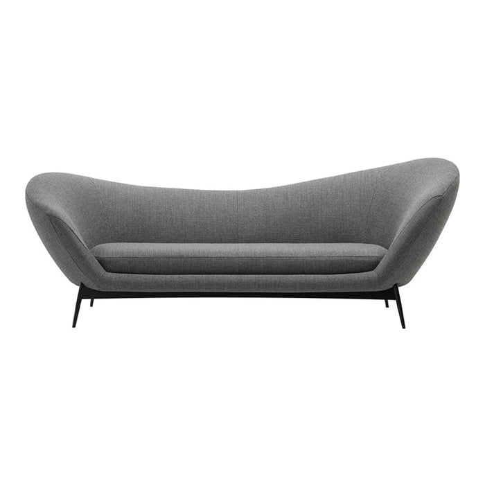 Gray upholstered sofa with a sleek, curved design and black metal legs, featuring a minimalist modern aesthetic.