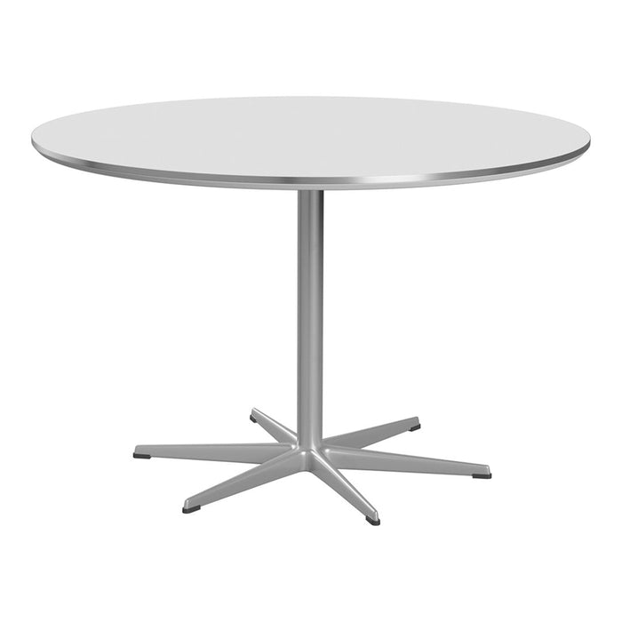 Round table with a sleek white top and a modern silver base, featuring a minimalist design and smooth surfaces.