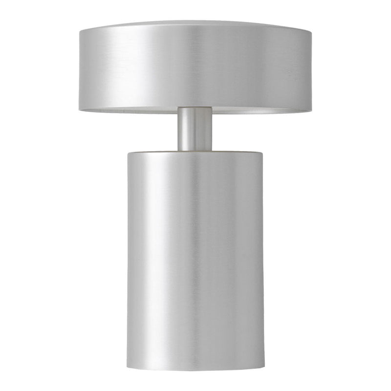 Sleek silver lamp with a modern cylindrical base and round top, featuring a smooth metallic finish.