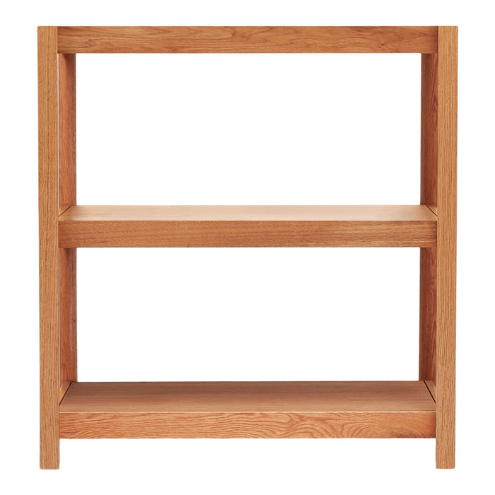 Wooden shelving unit in warm oak finish with a simple, minimalist design and smooth, natural grain pattern.