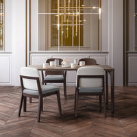 Modern dining set featuring gray and white chairs with a wood-patterned floor and elegant light fixtures.