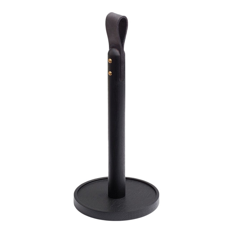 Black paper towel holder with a smooth leather texture and brass accents. Sleek and modern design.