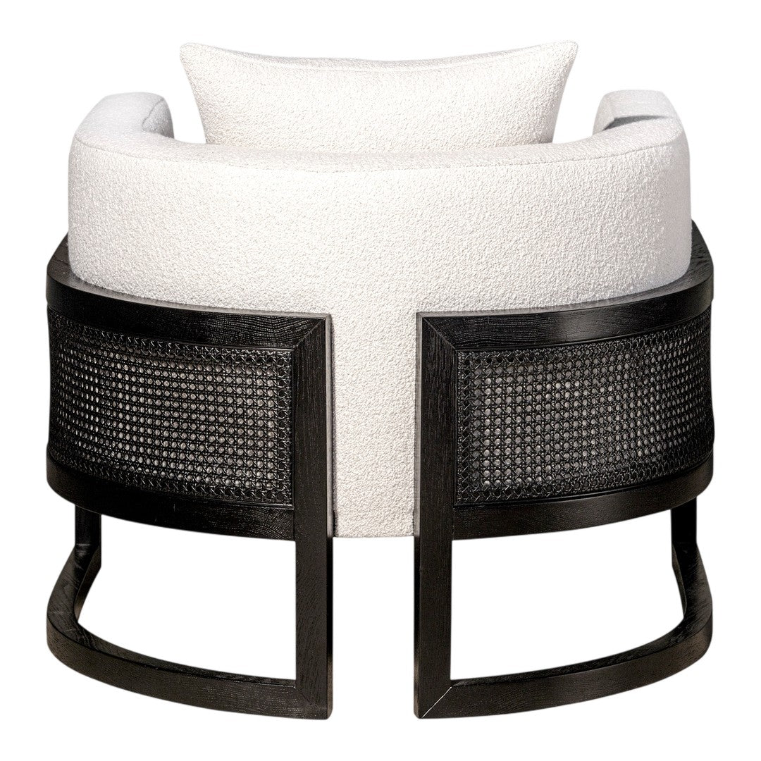 White boucle upholstery with a sleek black woven base, creating a modern and stylish contrast.