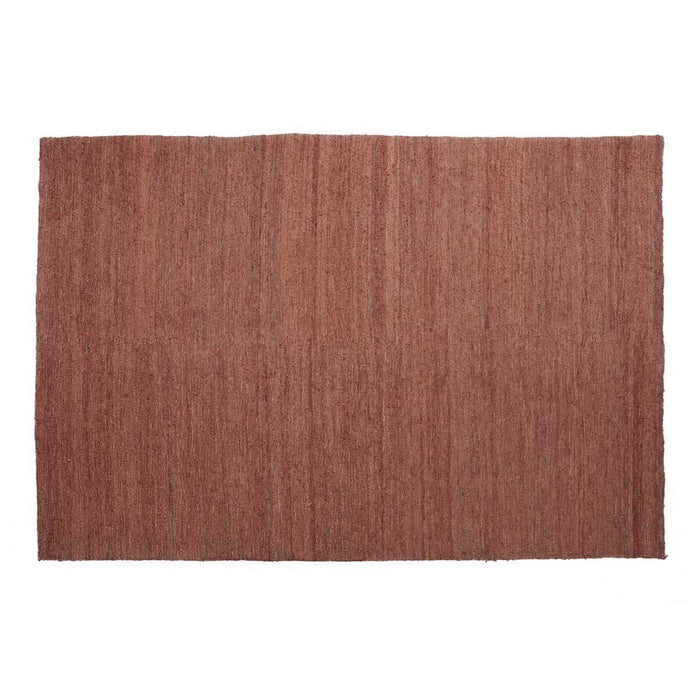 Textured rectangular rug in warm terracotta color with subtle vertical stripes, adding a cozy touch to any room.