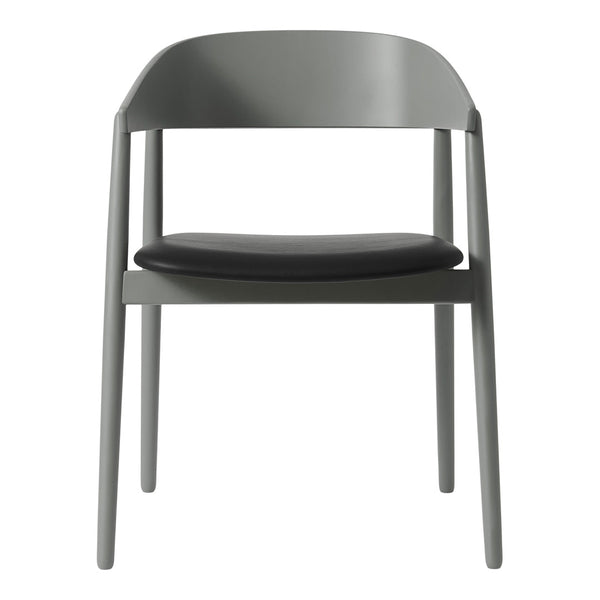 Gray chair with a sleek matte finish and a contrasting black leather seat, perfect for modern interiors.