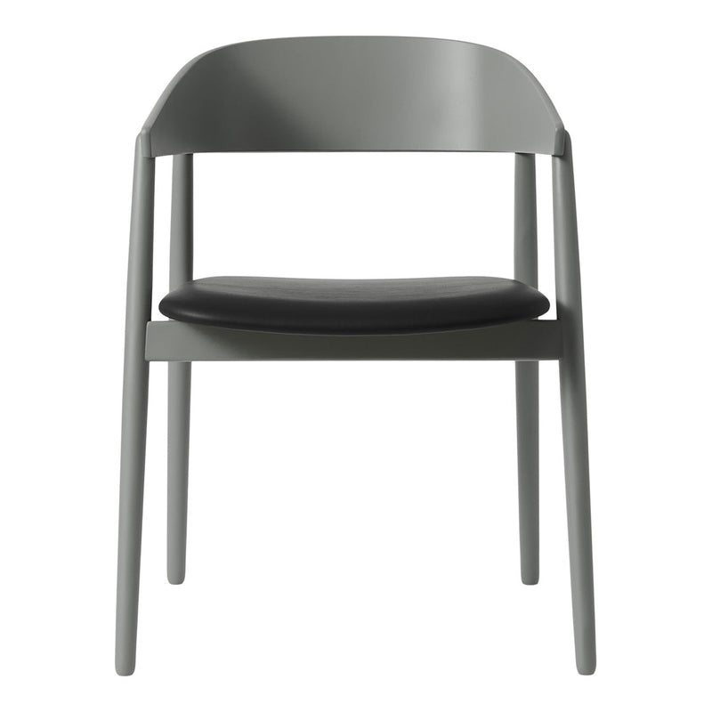 Gray chair with a sleek matte finish and a contrasting black leather seat, perfect for modern interiors.