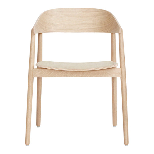 Light wood chair with a smooth grain pattern and a neutral, creamy seat for a modern, minimalist look.