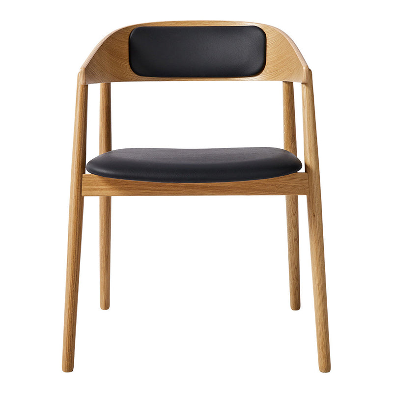 Natural wood chair with a light oak finish and a sleek black leather seat and back for a modern touch.