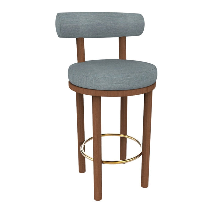 Grey upholstered bar stool with a round seat and backrest, featuring wooden legs and a gold footrest.