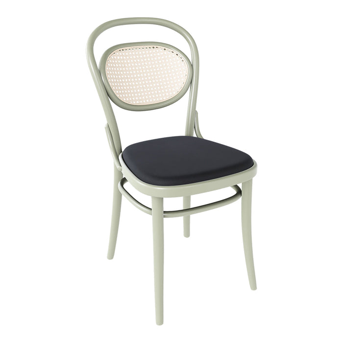 Vintage-style chair in sage green with a woven back and dark blue cushion for a chic, modern look.