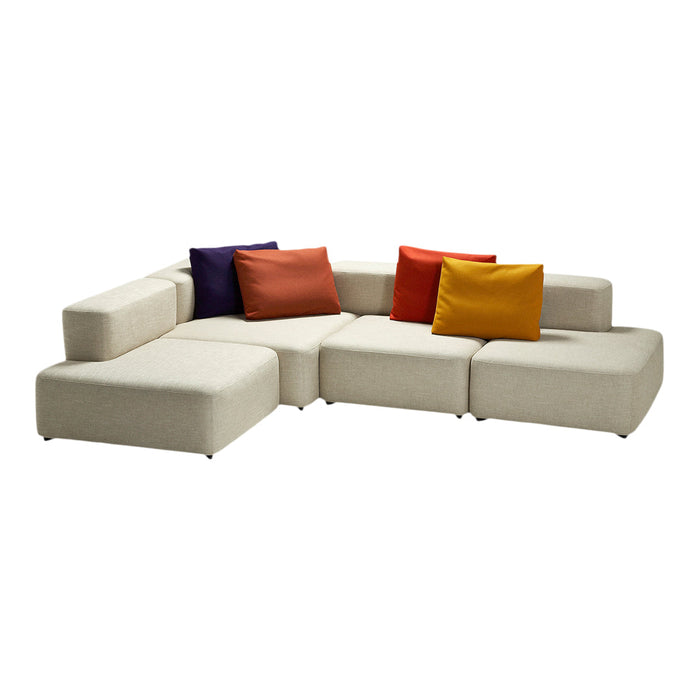 Beige sectional sofa with colorful throw pillows in purple, orange, and yellow, featuring a modern, minimalist design.