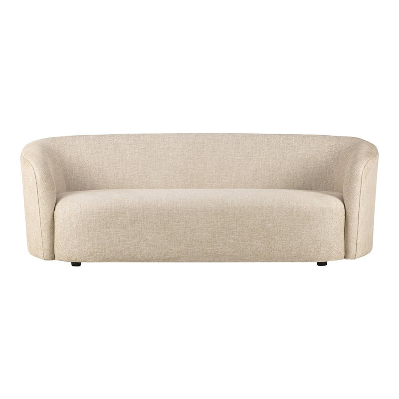 Beige curved sofa with a smooth, textured finish, ideal for modern living spaces.