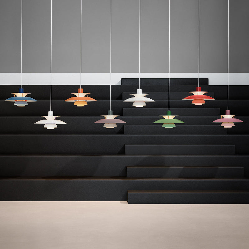 Colorful pendant lights in red, blue, green, orange, and white, featuring sleek, modern designs against a black backdrop.