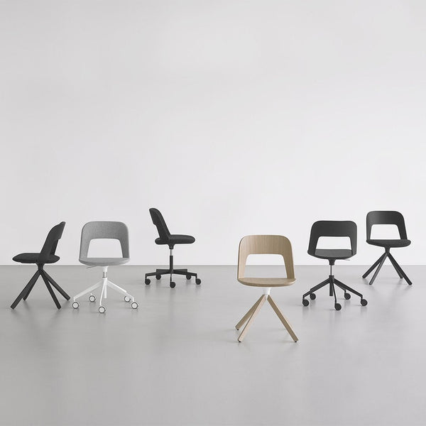 Six modern chairs in shades of black, white, gray, and tan, featuring sleek lines and minimalist designs.