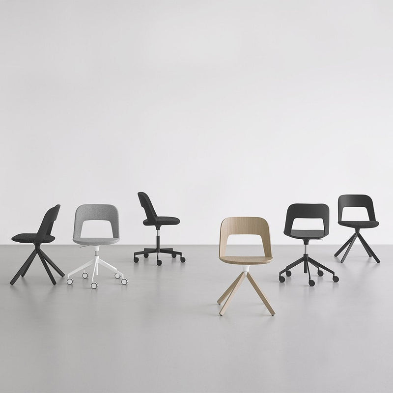 Six modern chairs in shades of black, white, gray, and tan, featuring sleek lines and minimalist designs.
