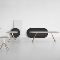 Modern furniture display featuring a mix of black, white, and natural wood tones with sleek, minimalist designs.