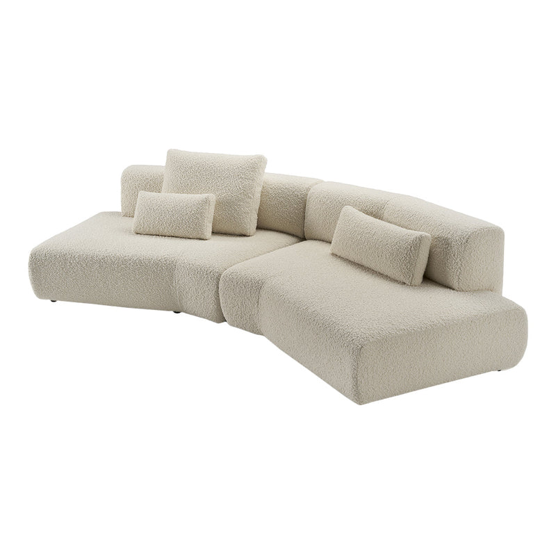 Beige textured sectional sofa with plush cushions, featuring a modern, minimalist design. Perfect for contemporary interiors.