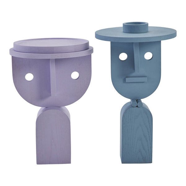 Two abstract wooden sculptures in lavender and blue, featuring geometric shapes and playful designs.