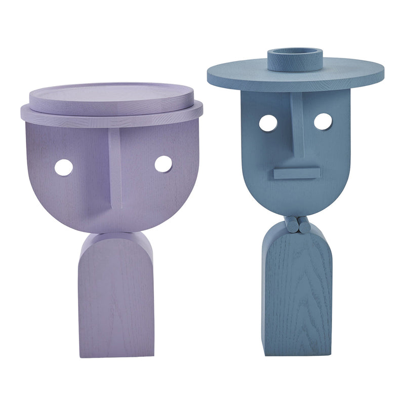 Two abstract wooden sculptures in lavender and blue, featuring geometric shapes and playful designs.